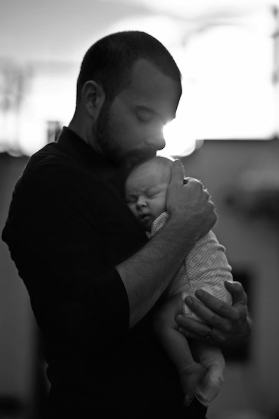 father holding baby son