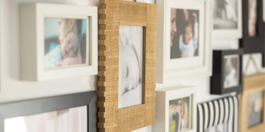 Displaying family photos on the wall.